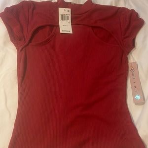 This is a burgundy top brand new , size xs, and tight fitted like a crop top.